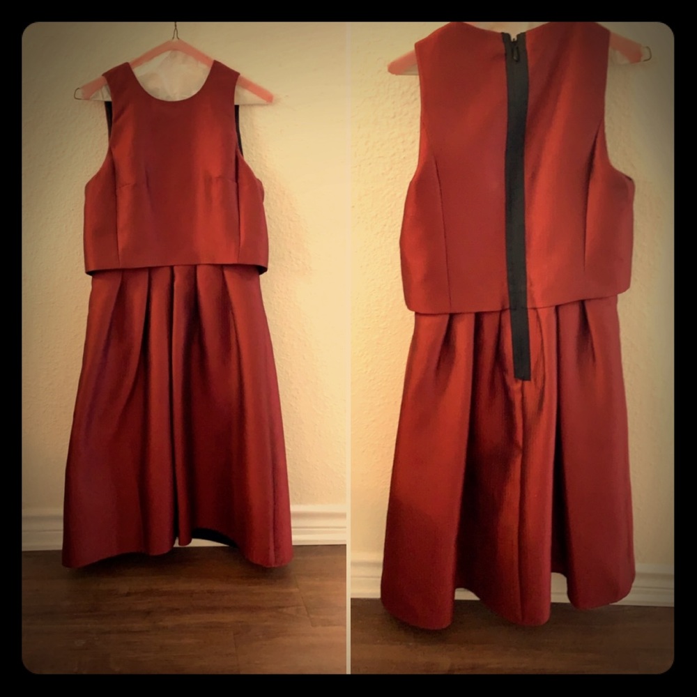 Deep red sleeveless dress.